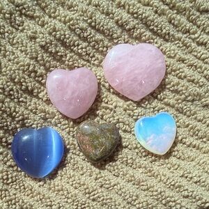 lot of heart healing crystals stones.